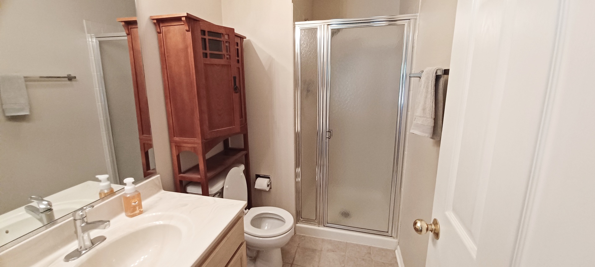 290 Crestview Drive, Unit C Wauconda, IL 60084 - Photo 18 of 19 a bathroom with a sink toilet and shower