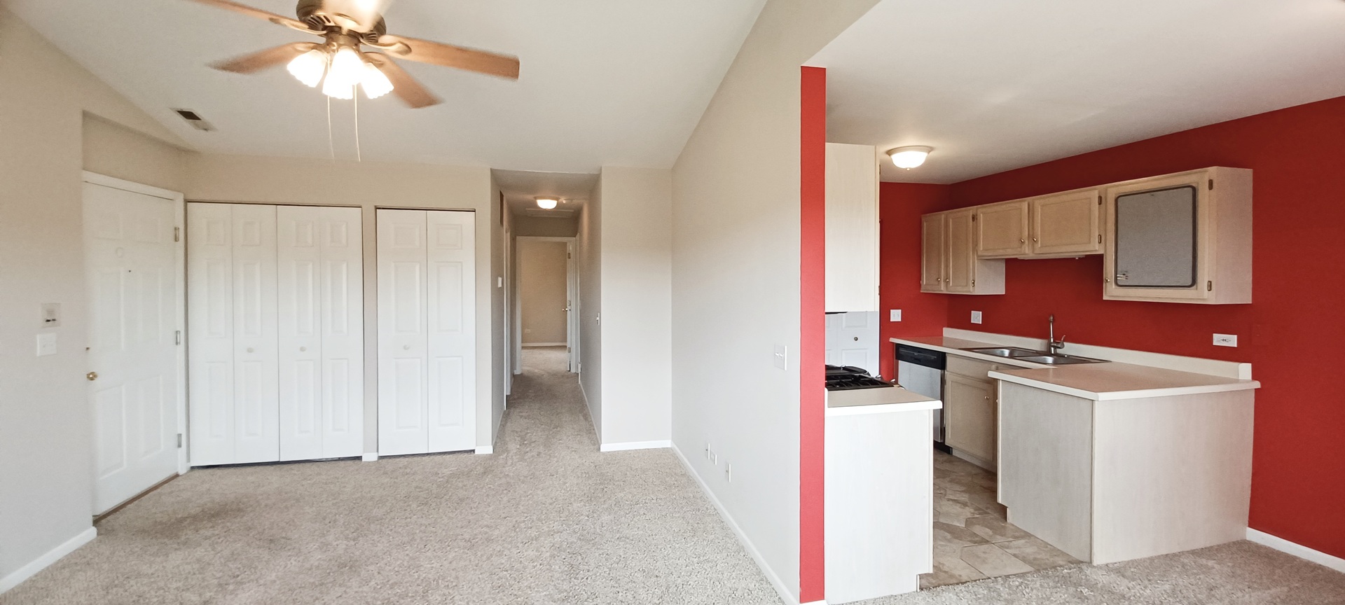 290 Crestview Drive, Unit C Wauconda, IL 60084 - Photo 7 of 19 a kitchen with stainless steel appliances kitchen island granite countertop a stove a sink and a refrigerator with wooden floor