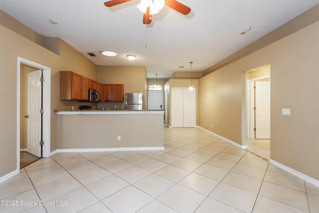 a view of a kitchen with a sink and cabinets