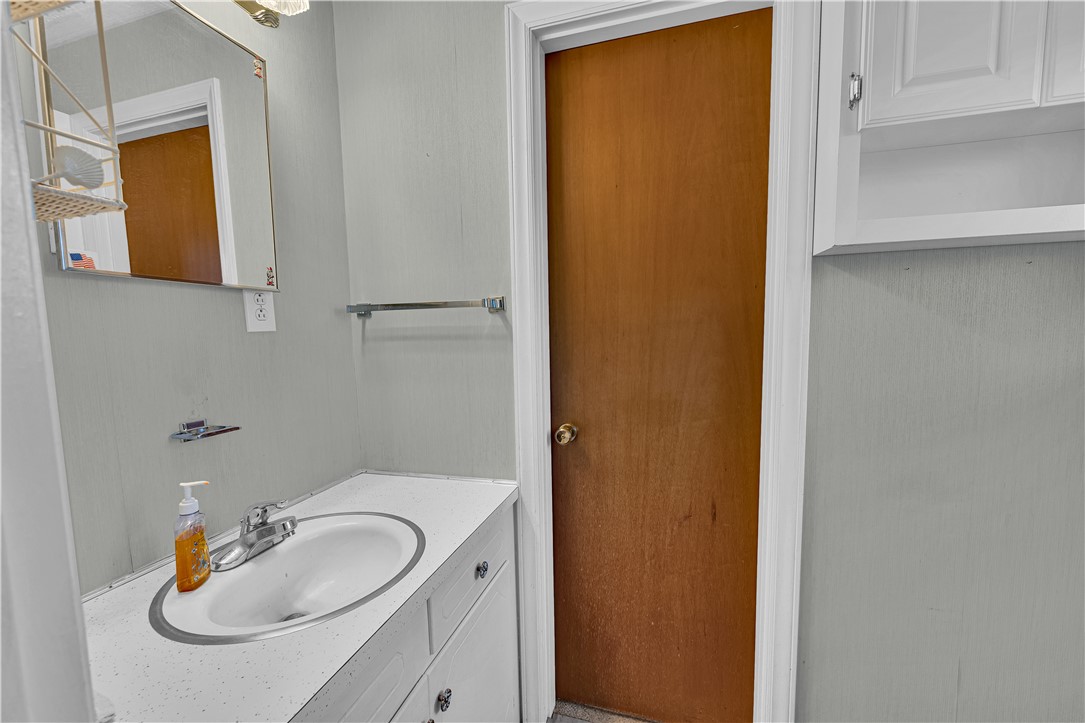 307 Calhoun Road Belton, SC 29627 - Photo 23 of 30 Compact and practical, this bathroom features a bright vanity and convenient storage.