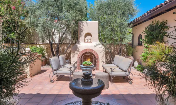 a view of a chairs and a table in the patio