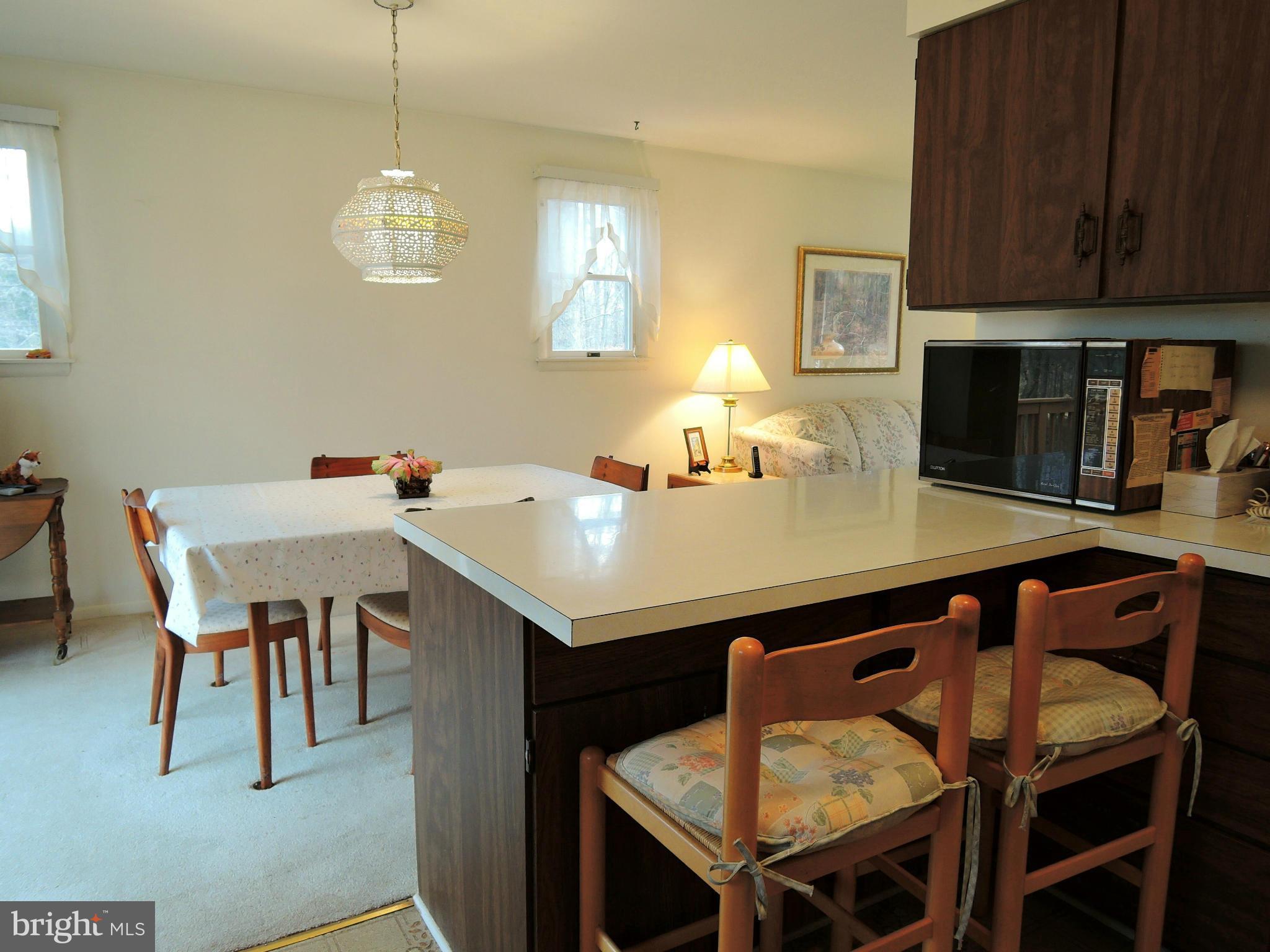 1010 Cold Bottom Road Sparks, MD 21152 - Photo 12 of 30 a view of a dining room with furniture and wooden floor