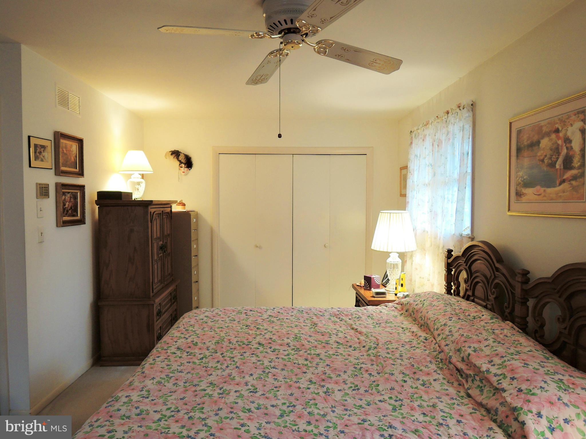 1010 Cold Bottom Road Sparks, MD 21152 - Photo 15 of 30 a bedroom with a bed and a chandelier