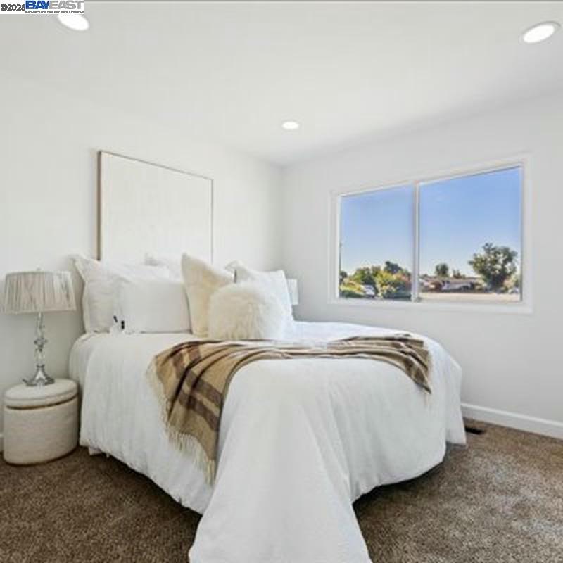 3184 Waugh Place Fremont, CA 94536 - Photo 24 of 47 a spacious bedroom with a bed and a window
