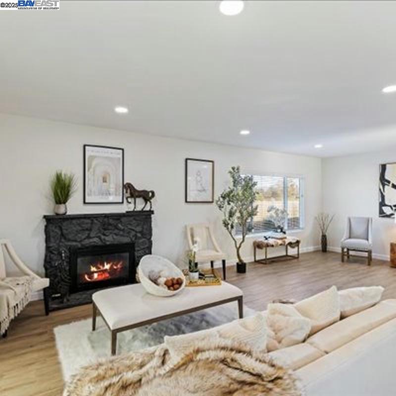 3184 Waugh Place Fremont, CA 94536 - Photo 44 of 47 a living room with furniture and a fireplace