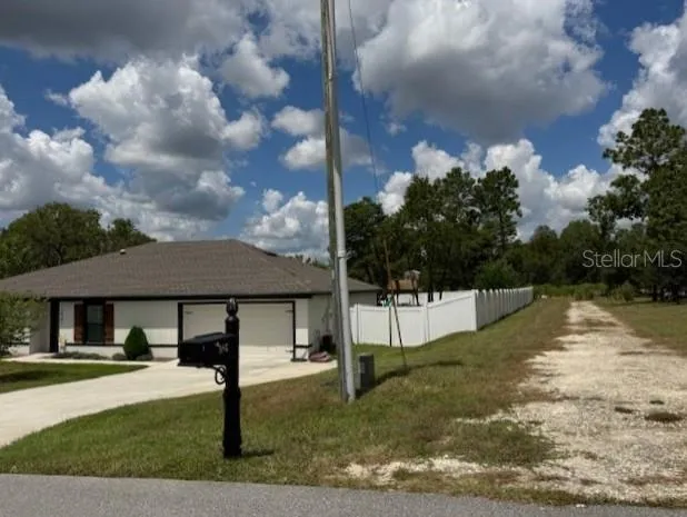 a view of a house with swimming pool yard and porch