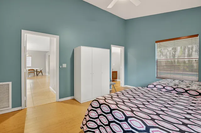 a bedroom with a bed and a table in it