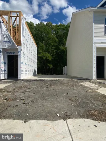 a view of a backyard of the house
