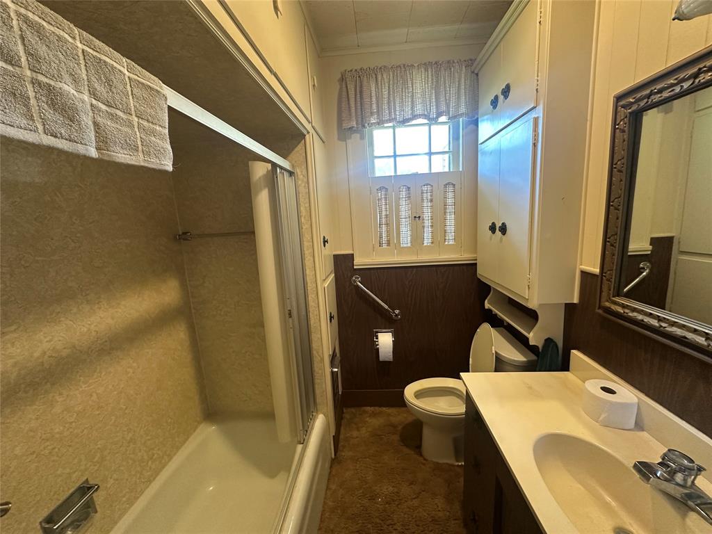 2276 Main Street Haynesville, LA 71038 - Photo 11 of 22 a bathroom with a sink a toilet and shower