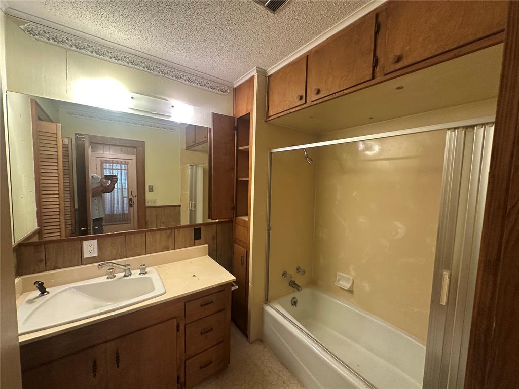 2276 Main Street Haynesville, LA 71038 - Photo 17 of 22 a bathroom with a sink and a mirror