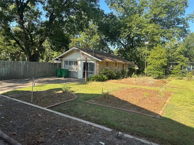 a view of house with swimming pool