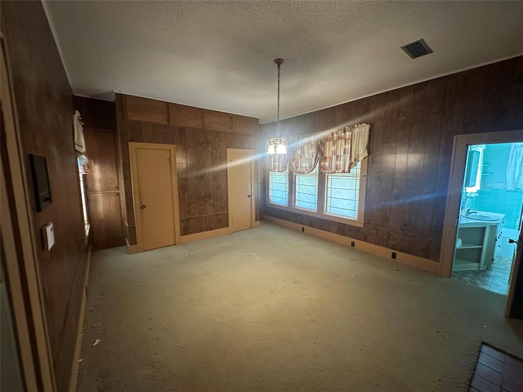 2276 Main Street Haynesville, LA 71038 - Photo 8 of 22 a view of an empty room with a fireplace and a window