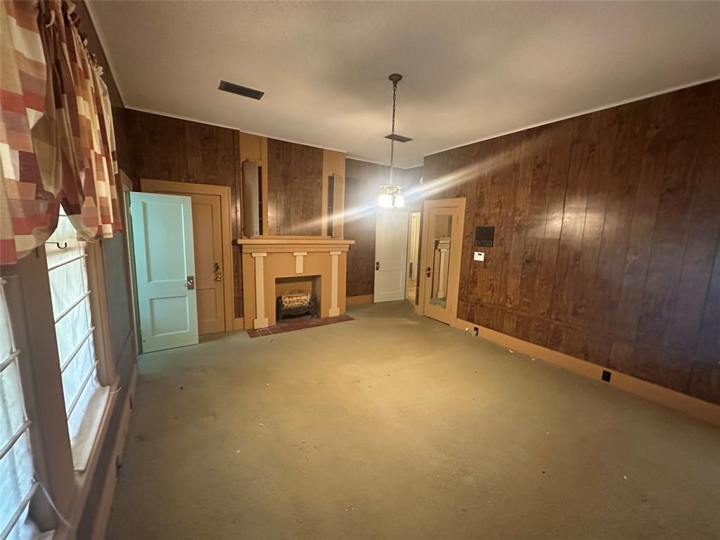 2276 Main Street Haynesville, LA 71038 - Photo 9 of 22 a view of empty room with a fireplace