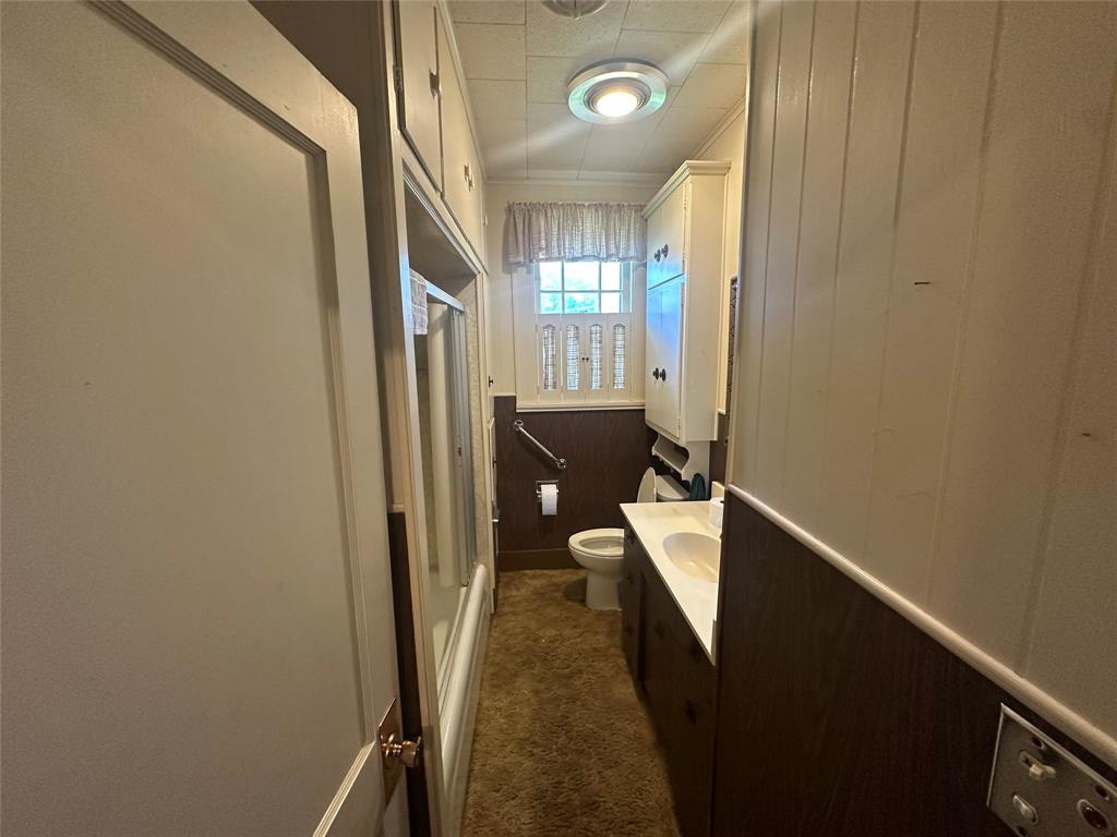 2276 Main Street Haynesville, LA 71038 - Photo 10 of 22 a hallway with furniture and a gate