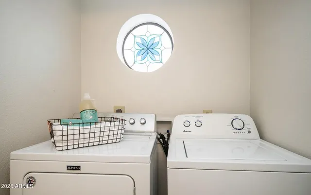 a utility room with dryer and washer