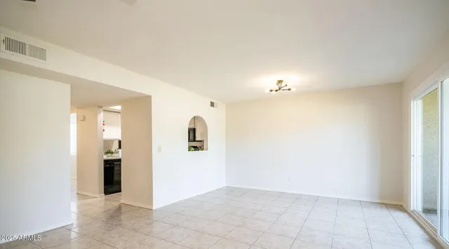 a view of a kitchen with an empty room