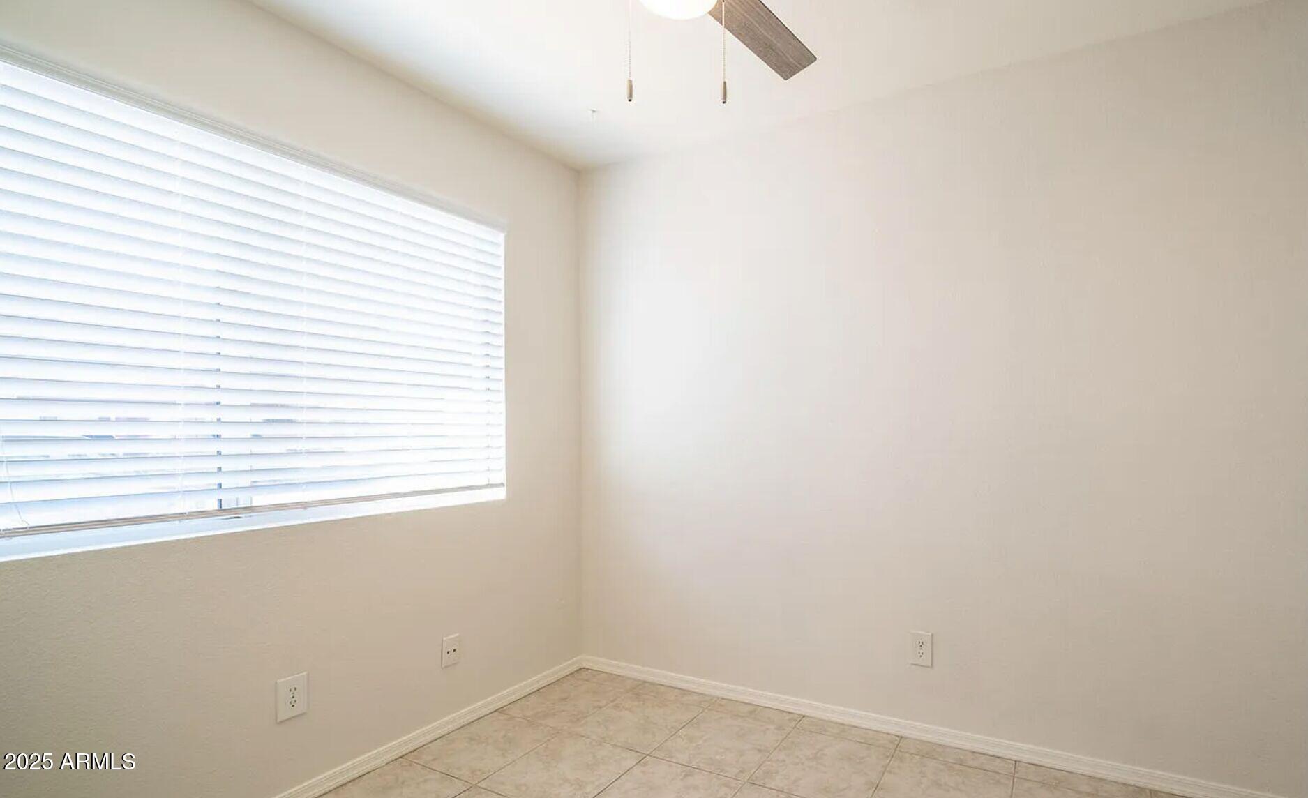 1329 South Mitchell Drive Tempe, AZ 85281 - Photo 8 of 21 an empty room with a window