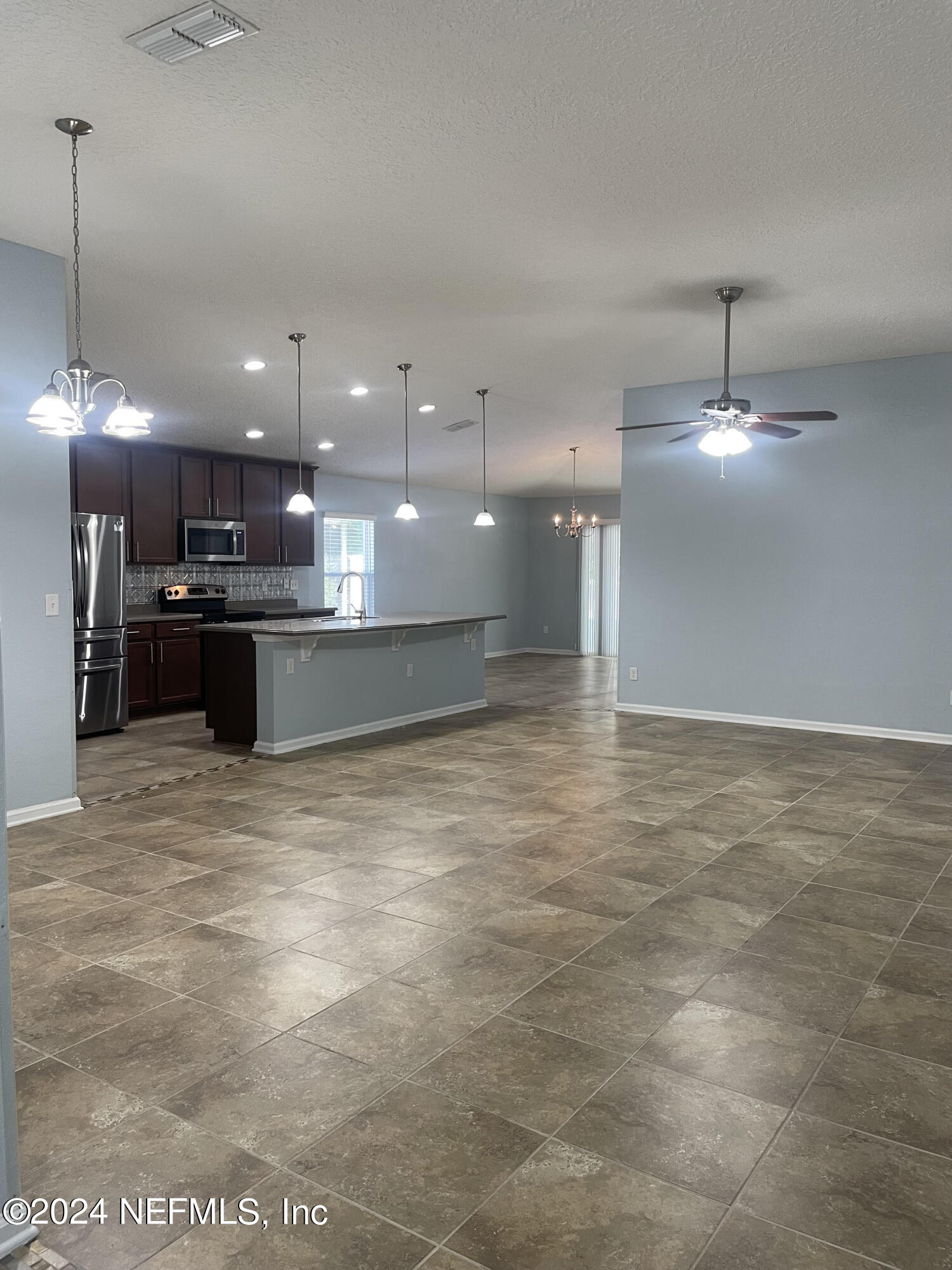 327 North Twin Maple Road St. Augustine, FL 32084 - Photo 7 of 9 a view of a kitchen with a sink and a stove