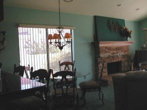 375-48 London Bridge Road, Unit 48 Lake Havasu City, AZ 86403 - Photo 6 of 9 a living room with furniture a flat screen tv and a fireplace
