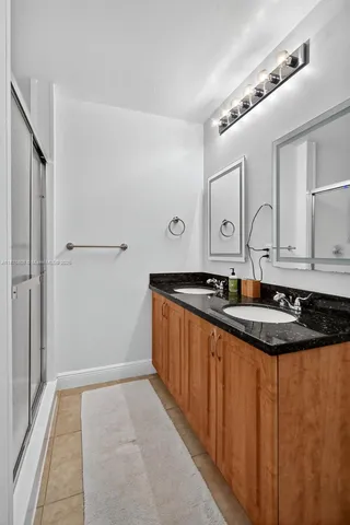 a bedroom with a bed and flat screen tv