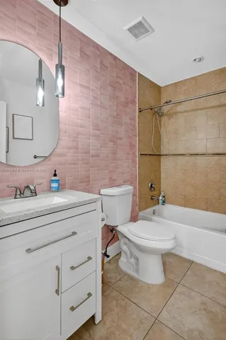 an aerial view of residential houses with outdoor space and street view