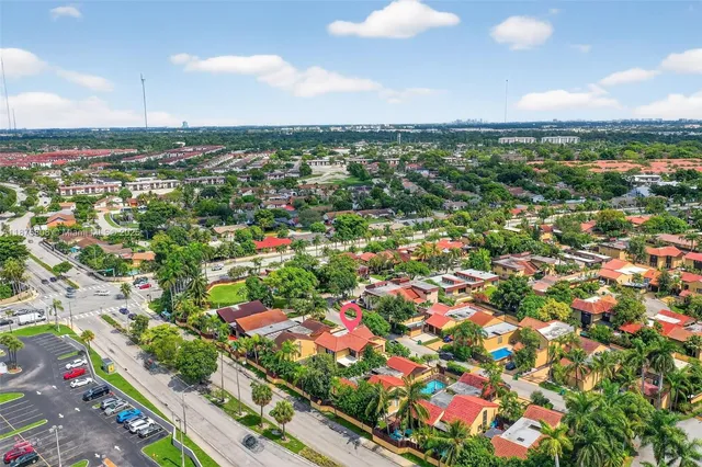 an aerial view of residential houses with outdoor space
