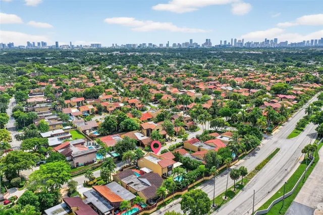 an aerial view of residential houses with outdoor space