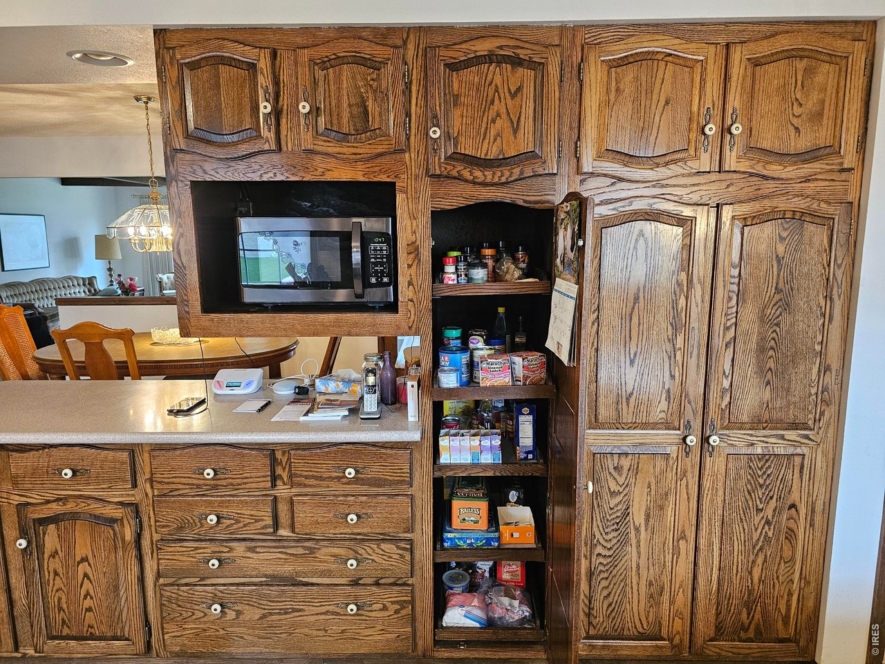 1010 Fairhurst Street Sterling, CO 80751 - Photo 12 of 36 a kitchen with stainless steel appliances granite countertop a refrigerator and a stove top oven