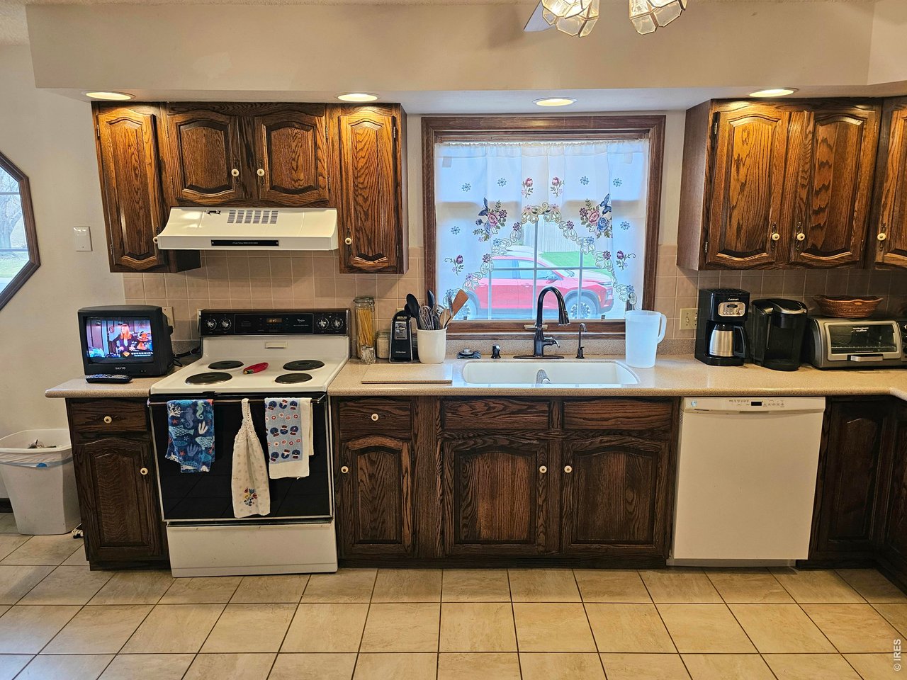 1010 Fairhurst Street Sterling, CO 80751 - Photo 13 of 36 a kitchen with stainless steel appliances granite countertop a stove and cabinets
