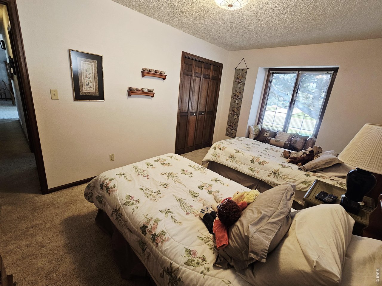 1010 Fairhurst Street Sterling, CO 80751 - Photo 21 of 36 a bedroom with a bed and a window