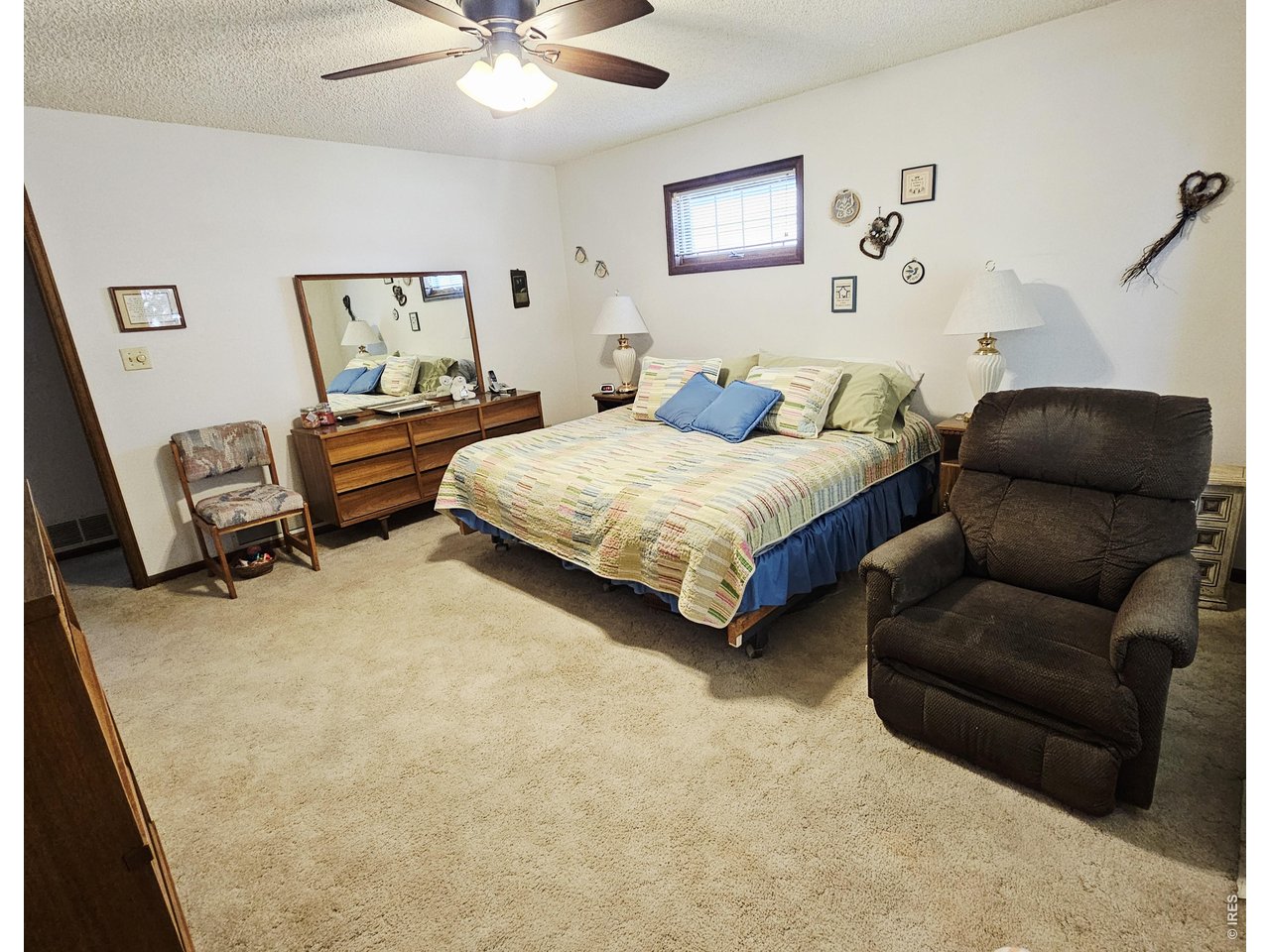 1010 Fairhurst Street Sterling, CO 80751 - Photo 27 of 36 a bedroom with bed and window