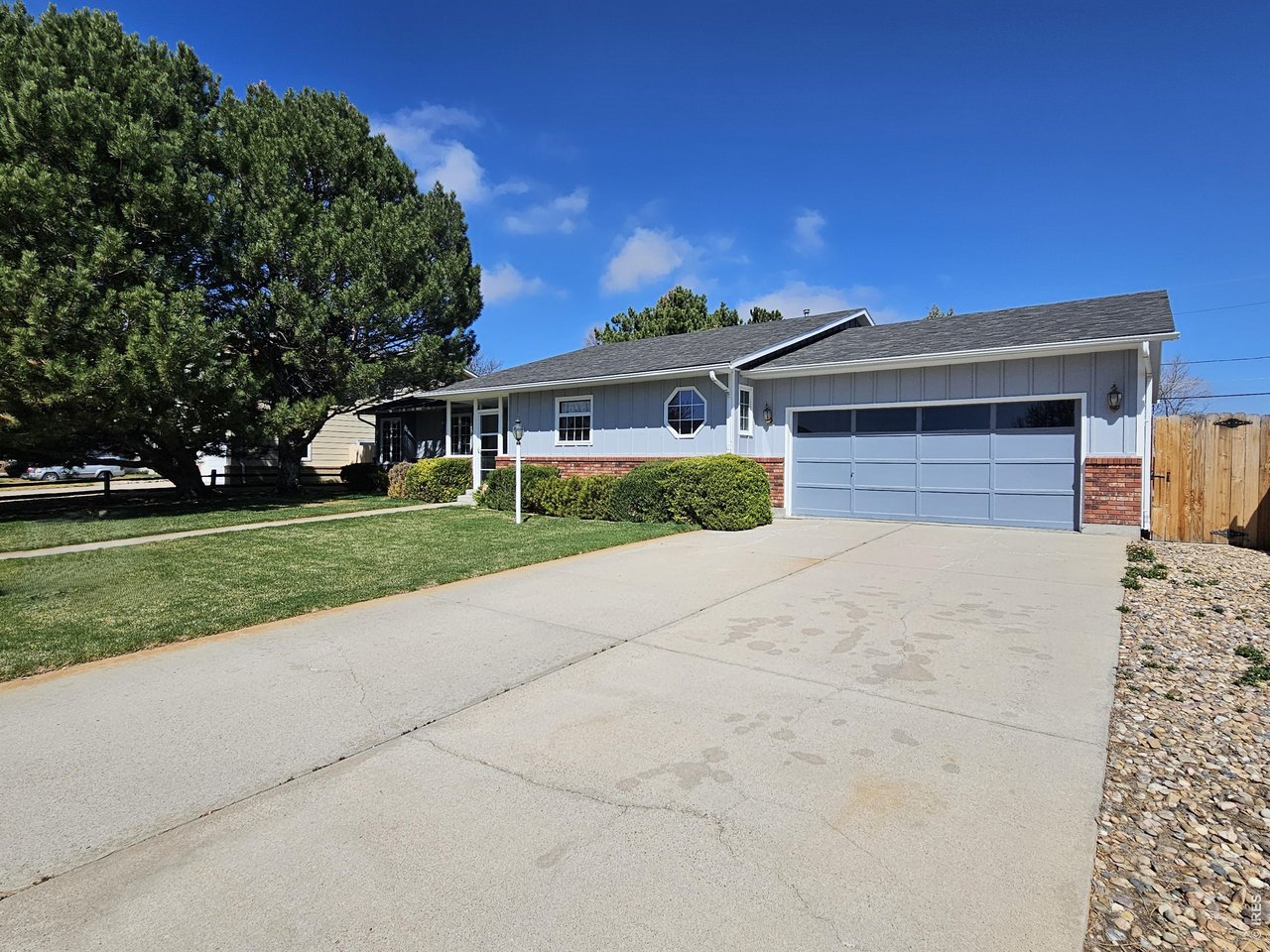 1010 Fairhurst Street Sterling, CO 80751 - Photo 34 of 36 a front view of a house with a yard