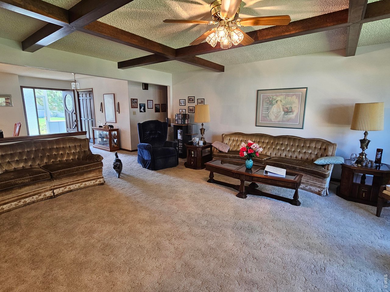1010 Fairhurst Street Sterling, CO 80751 - Photo 5 of 36 a living room with furniture and a chandelier
