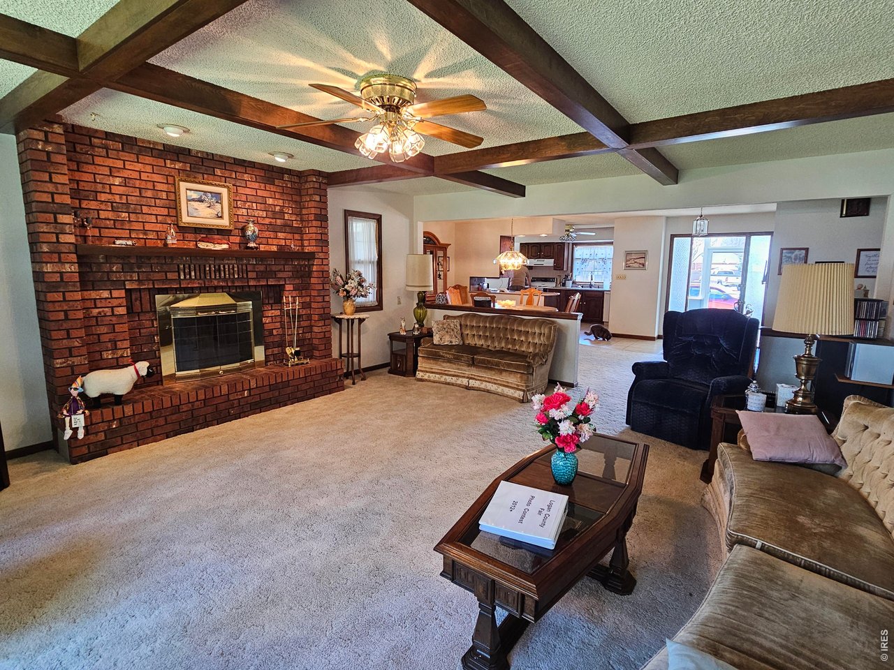 1010 Fairhurst Street Sterling, CO 80751 - Photo 6 of 36 a living room with furniture and a fireplace