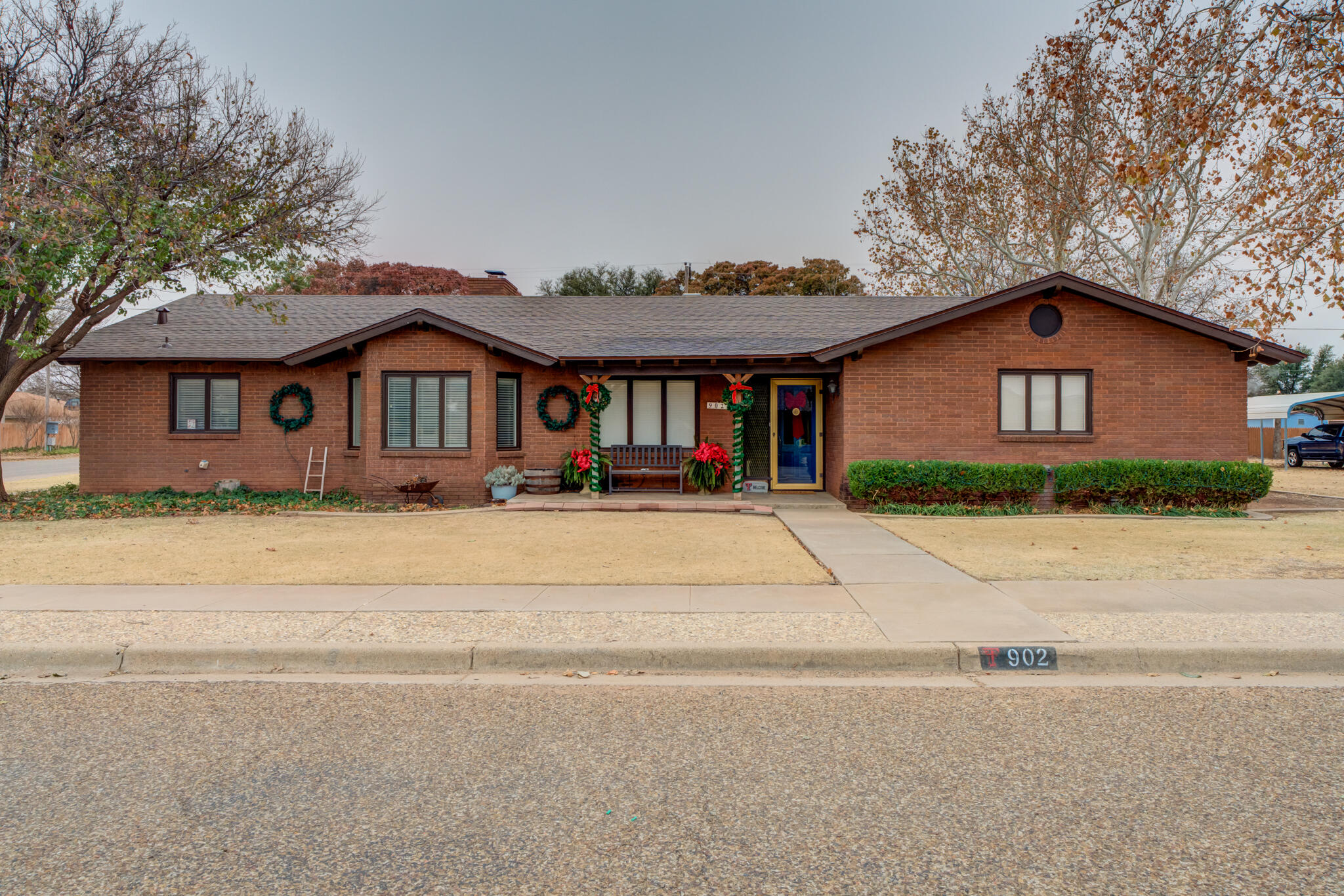 902 West 6th Street Idalou, TX 79329 - Photo 1 of 42 a front view of a house with a yard