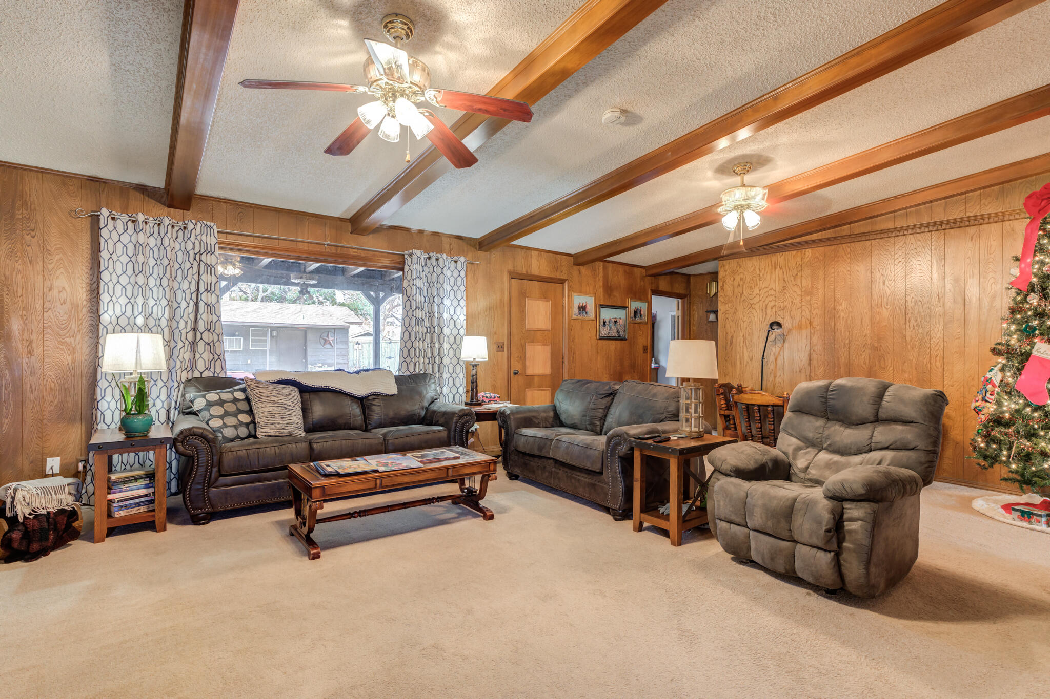 902 West 6th Street Idalou, TX 79329 - Photo 10 of 42 a living room with furniture and a chandelier
