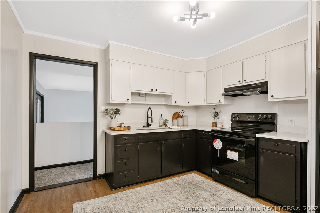 2743 George Owen Road Fayetteville, NC 28306 - Photo 16 of 47 a kitchen with stainless steel appliances granite countertop a stove a sink and a refrigerator