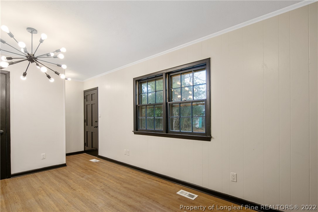 2743 George Owen Road Fayetteville, NC 28306 - Photo 21 of 47 a view of an empty room with a window and wooden floor