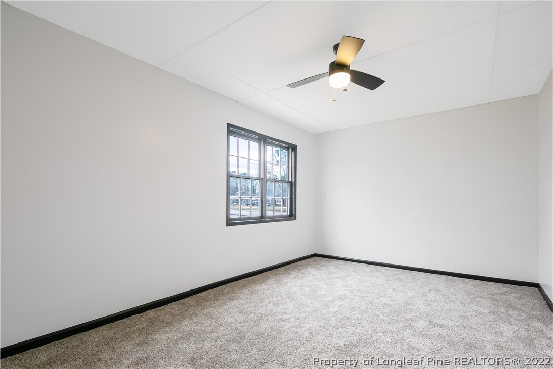 2743 George Owen Road Fayetteville, NC 28306 - Photo 23 of 47 an empty room with projector and windows