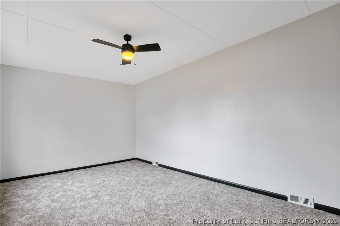 2743 George Owen Road Fayetteville, NC 28306 - Photo 24 of 47 a view of an empty room and stairs