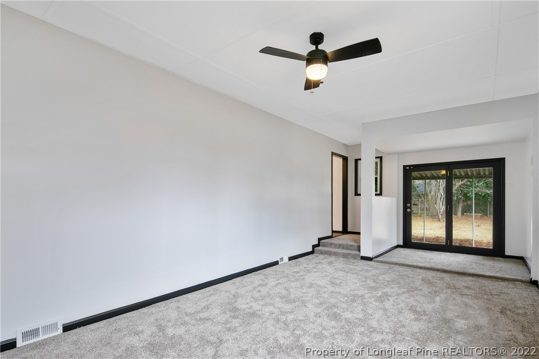 2743 George Owen Road Fayetteville, NC 28306 - Photo 25 of 47 an empty room with ceiling fan and window