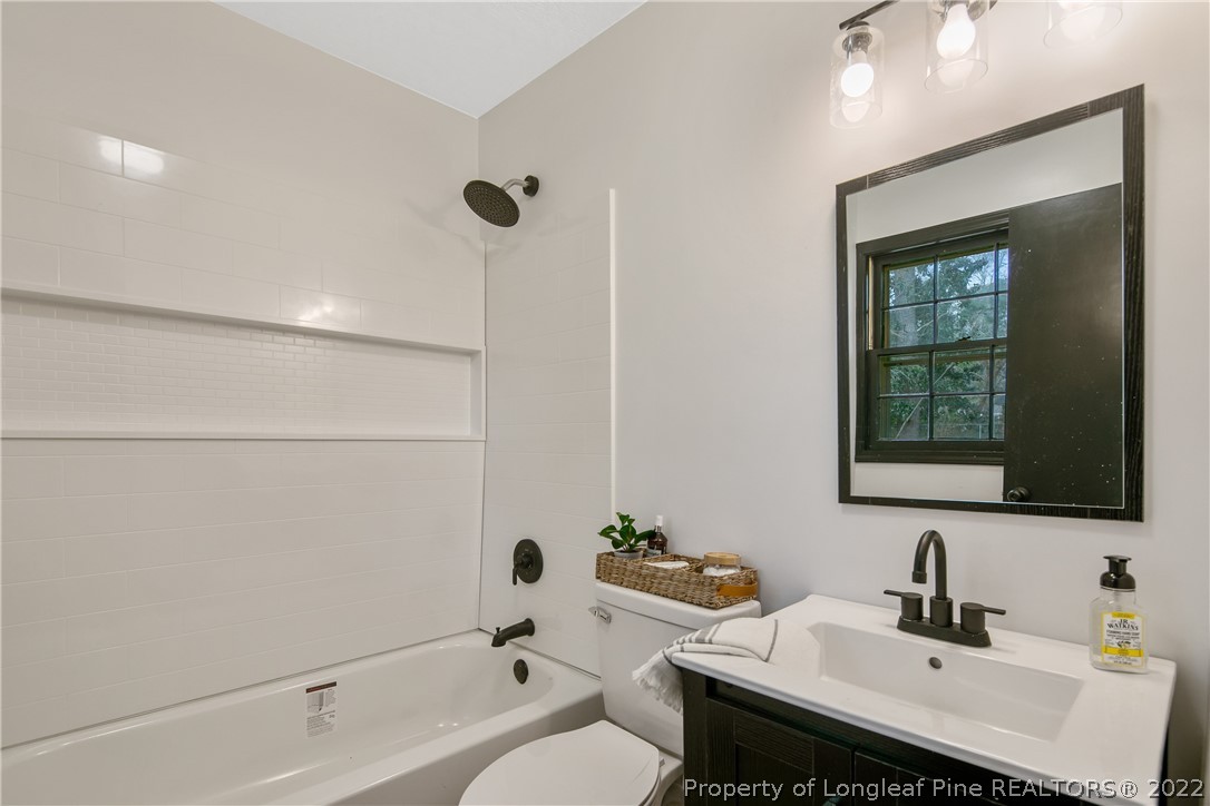 2743 George Owen Road Fayetteville, NC 28306 - Photo 32 of 47 a bathroom with a sink and a bathtub