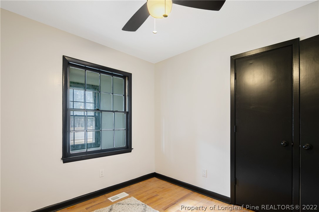 2743 George Owen Road Fayetteville, NC 28306 - Photo 35 of 47 a view of an empty room with wooden floor and a window