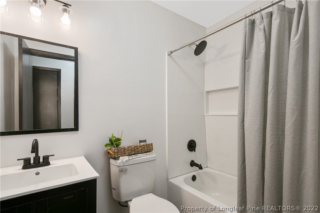 2743 George Owen Road Fayetteville, NC 28306 - Photo 39 of 47 a bathroom with a sink a toilet and shower