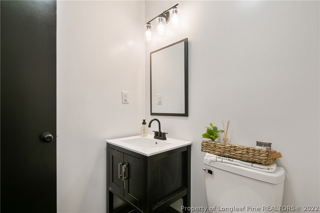 2743 George Owen Road Fayetteville, NC 28306 - Photo 40 of 47 a bathroom with a sink and a mirror