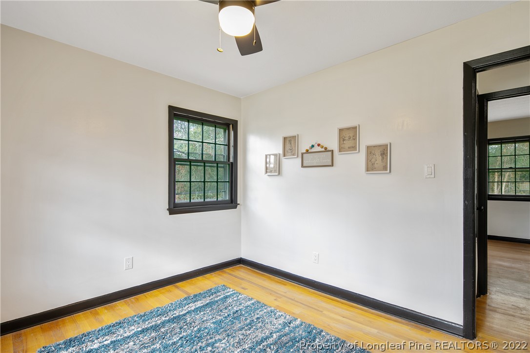 2743 George Owen Road Fayetteville, NC 28306 - Photo 42 of 47 a view of a room with wooden floor and windows