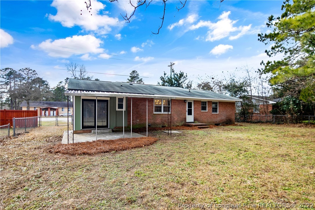 2743 George Owen Road Fayetteville, NC 28306 - Photo 46 of 47 a view of a house with a yard and sitting area