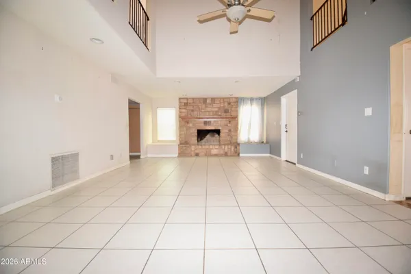 a kitchen with white cabinets and appliances