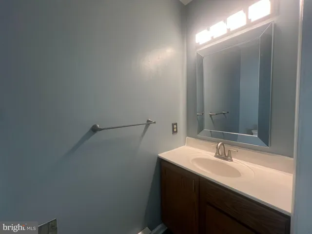 a bathroom with a sink and mirror