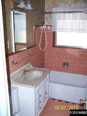 740-742 Monroe Street Reno, NV 89509 - Photo 4 of 5 a bathroom with a sink a vanity and a mirror
